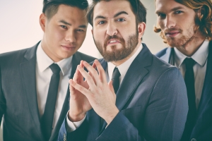 Bearded businessman with evil expression
